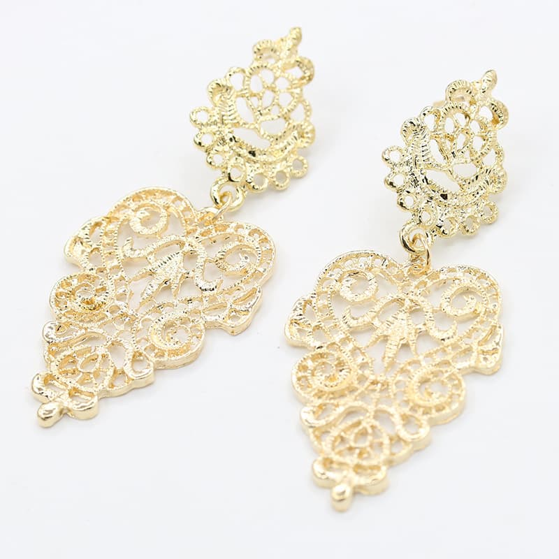 E1802 Европейские и американские горячие серьги AliExpress Джокер Богемные полые листья Защита окружающей среды Серьги из цинкового сплава