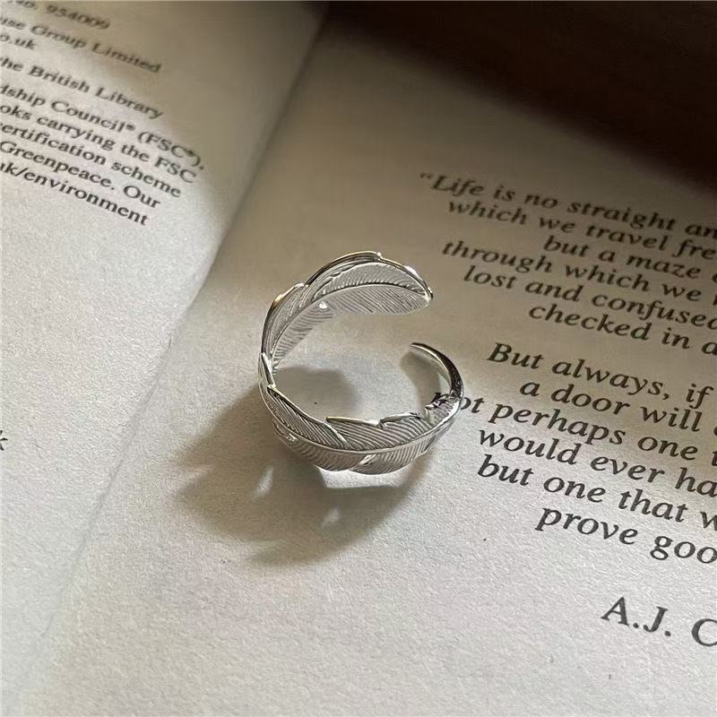 Кольцо-книжка с пером оптом из Китая